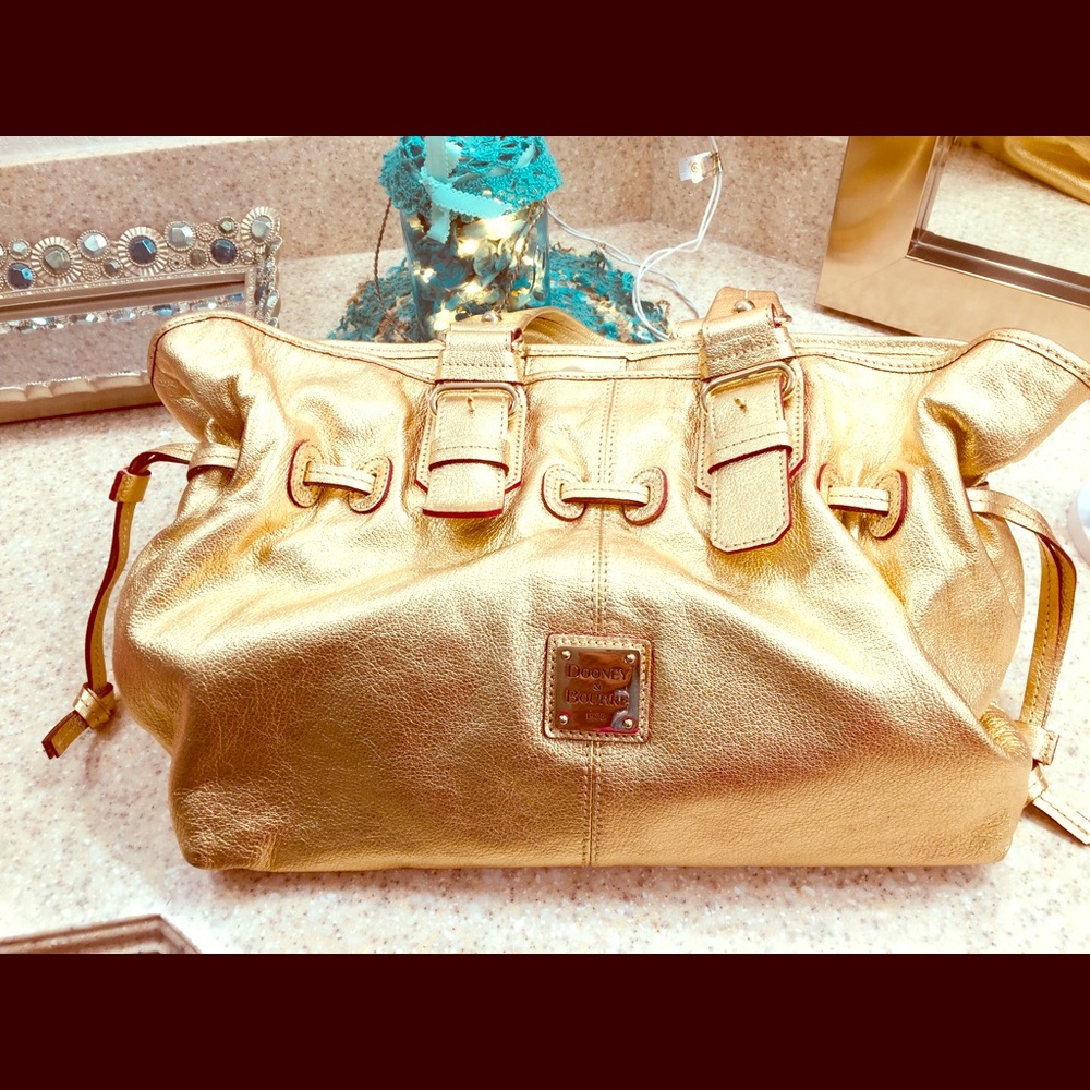 Large gold Dooney and Bourke purse
